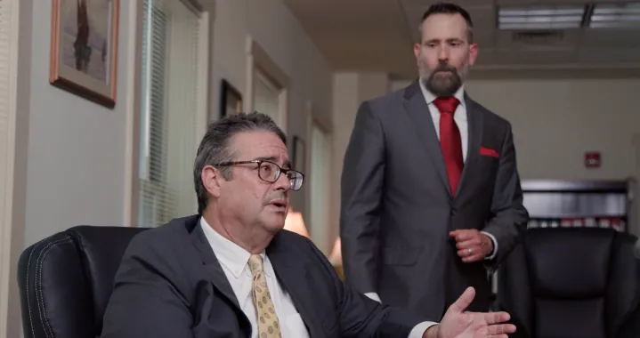 Attorneys talking to clients