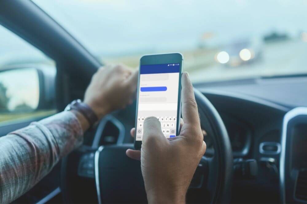 A man texting while driving