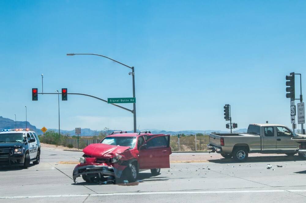 Red SUV caught in a Blind Intersection head-on crash.