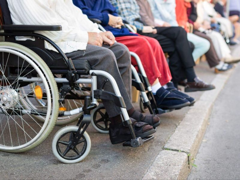 People sitting in a row during social security disability discussion