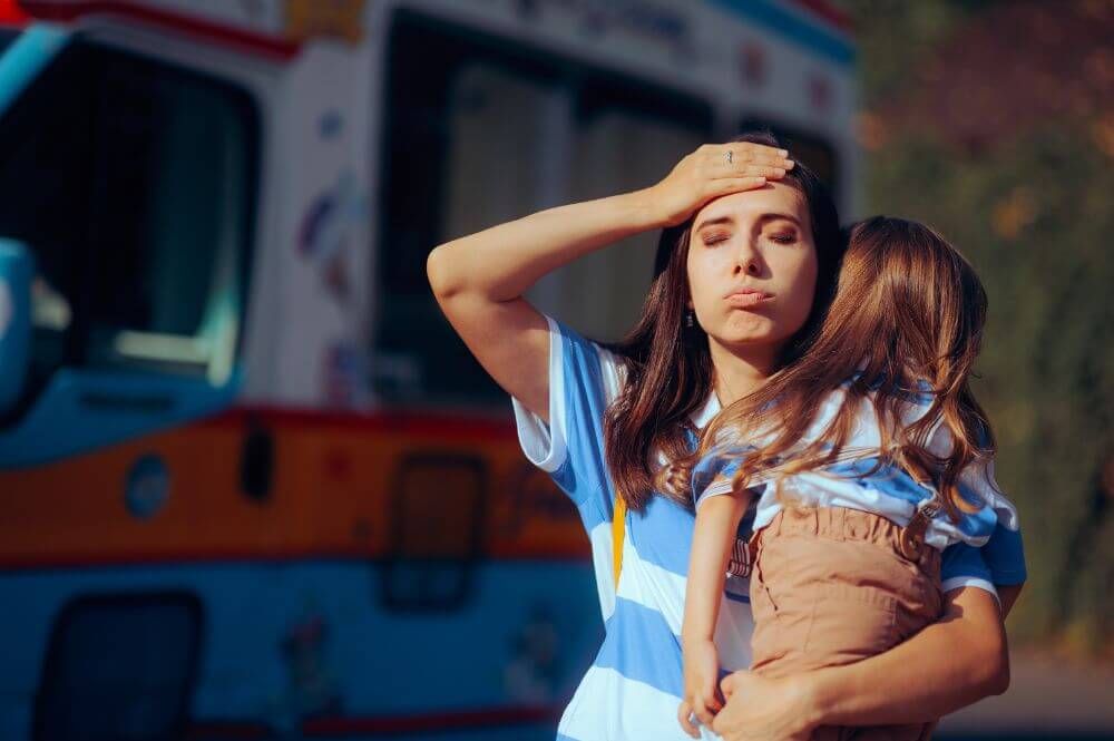 Mother in distress holding her daughter