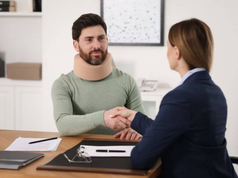 Injured man shaking hands with a Montagna Attorney