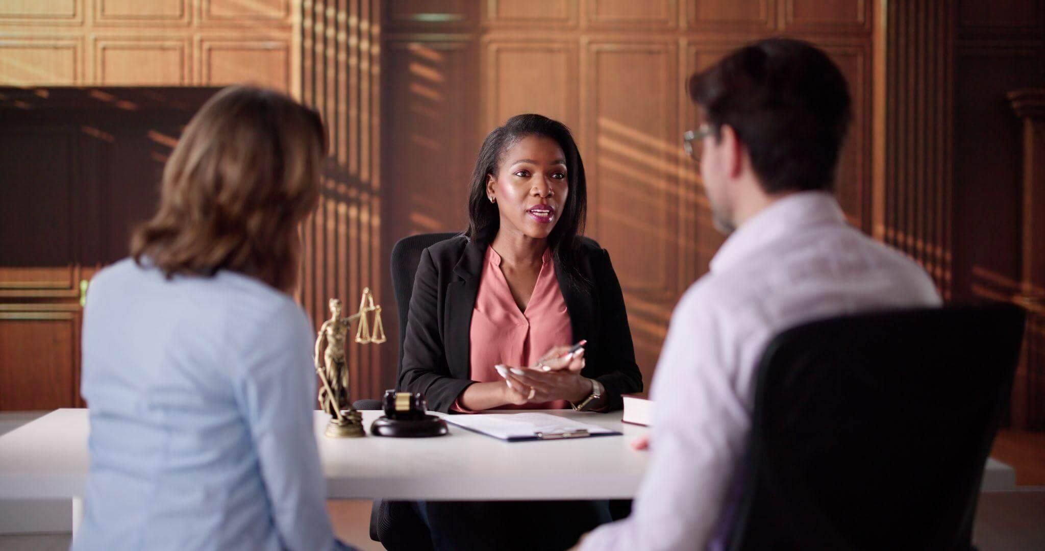 Three women discussing divorce costs at a table