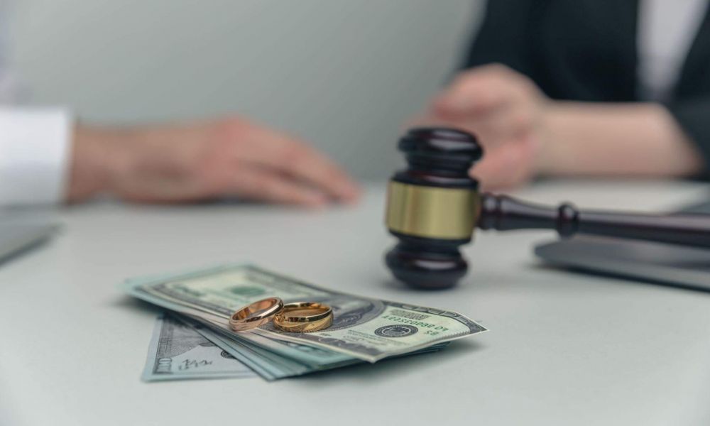 a judge's gavel and a stack of money on a table