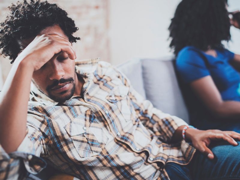 couple fighting on couch who need a divorce