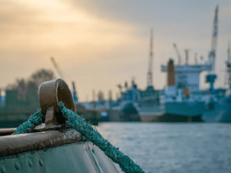 looking out at a harbor at dusk