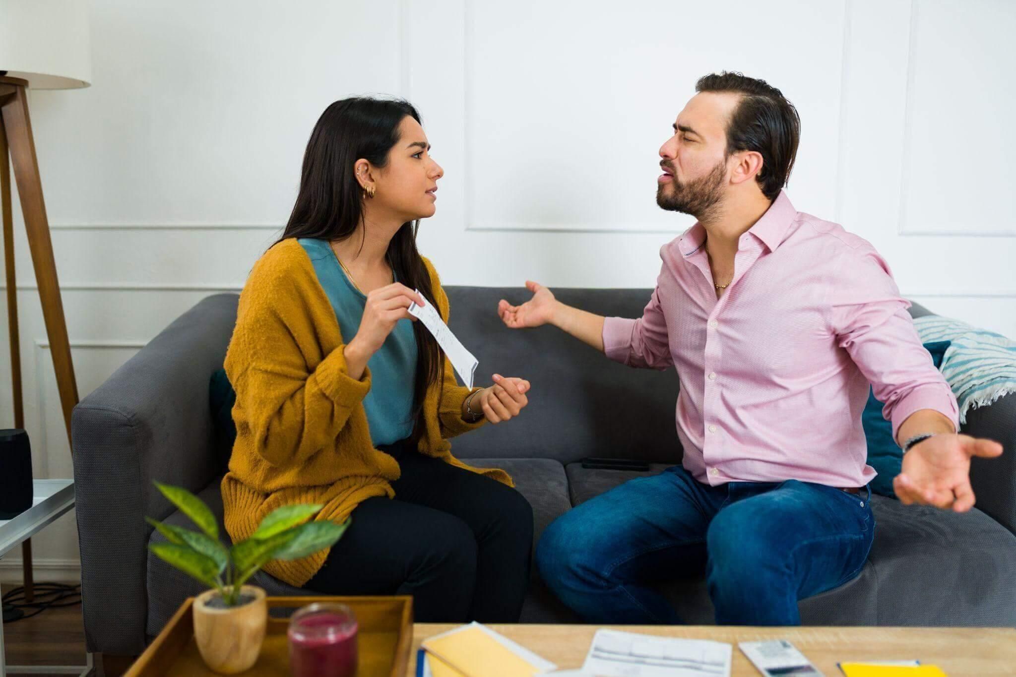 A man and a woman discussing debt responsibilities after separation