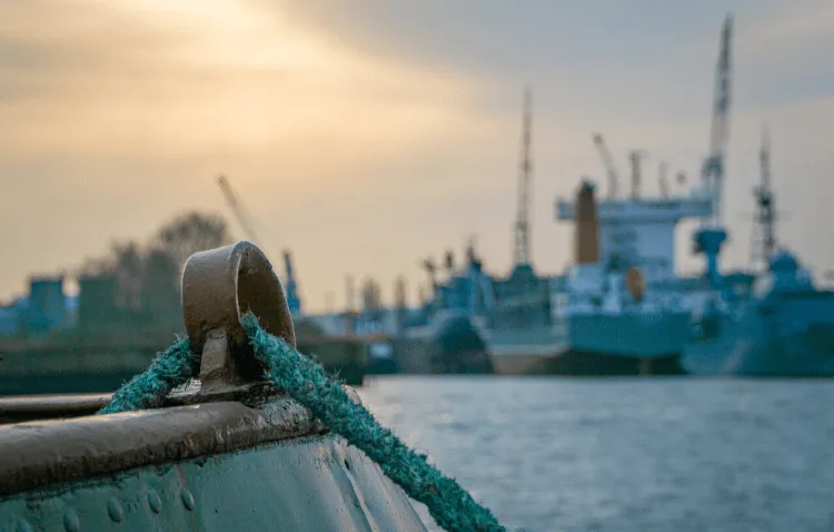 looking out at a harbor at dusk