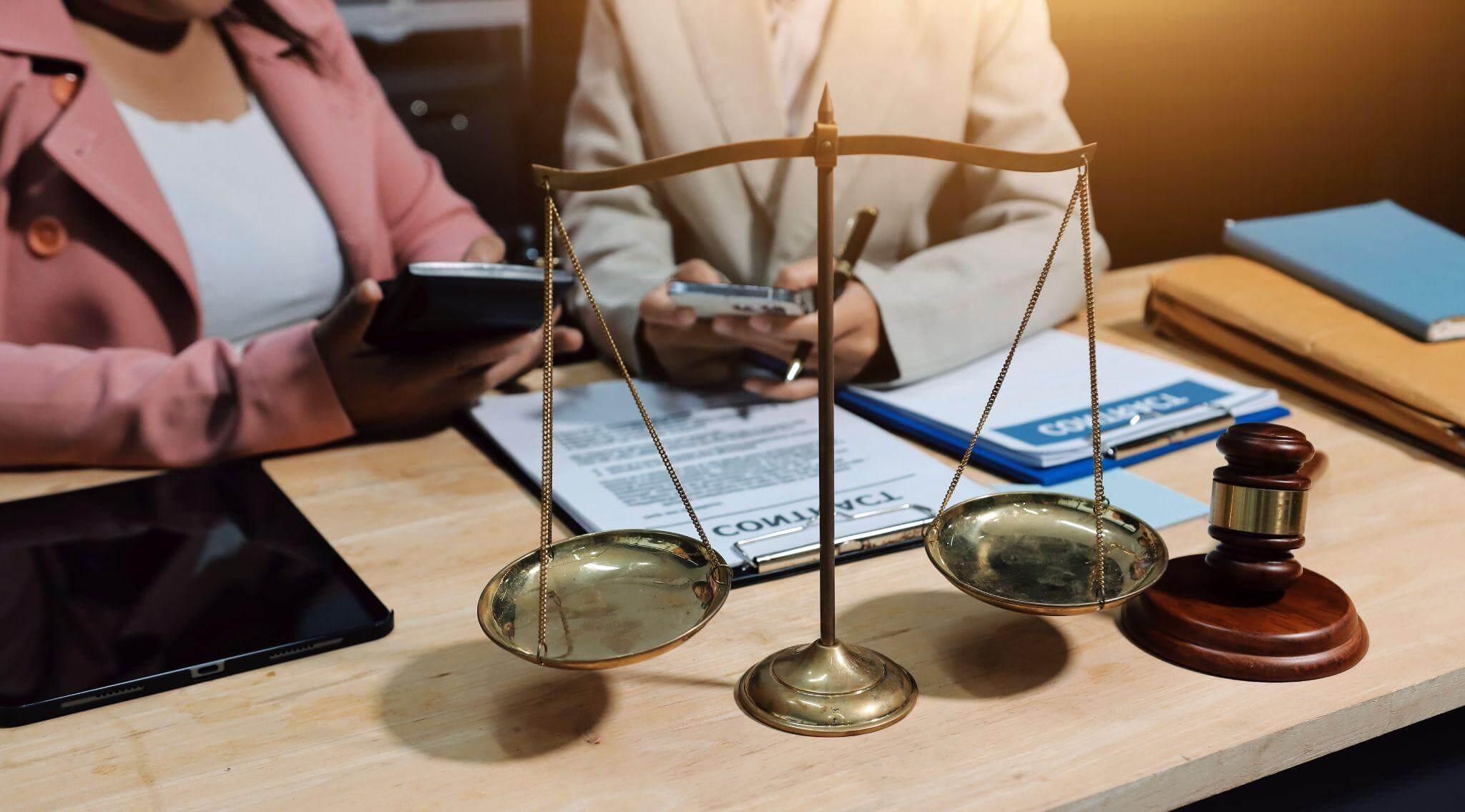 a judge and a woman sitting at a desk