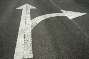 two people shaking hands over a signed document