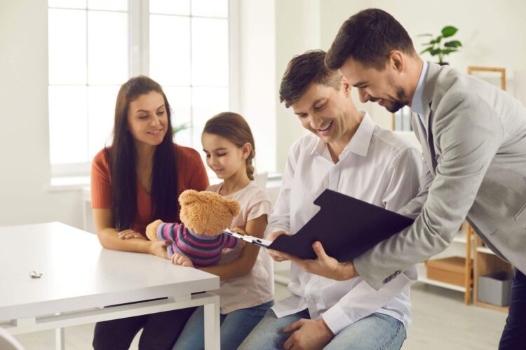 attorneys-meeting-with-clients-around-table-with-teddy-bear.jpeg