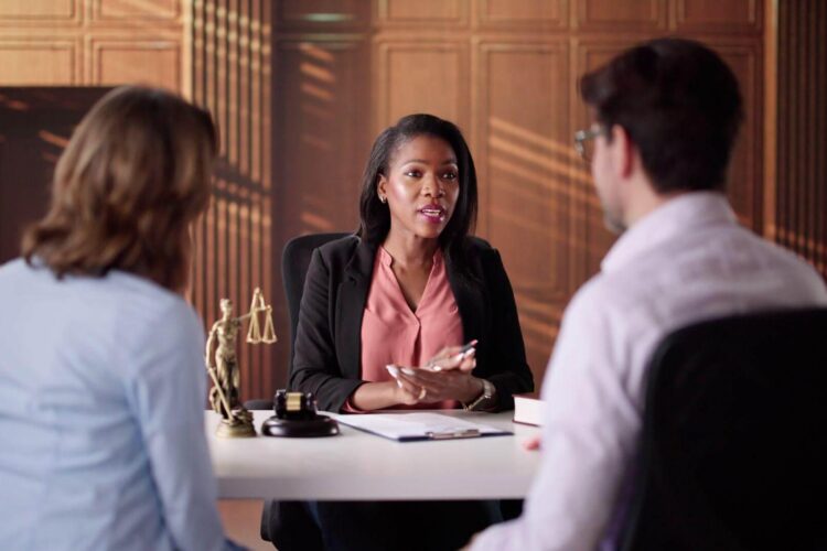 a person on a stretcher being assisted by a person in a safety vest