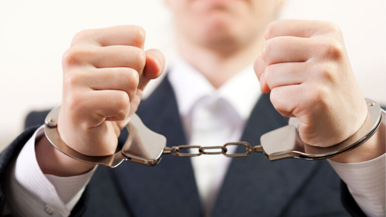 Handcuffs on hands