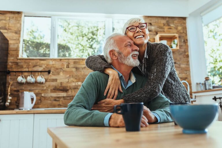 older couple happy and hugging