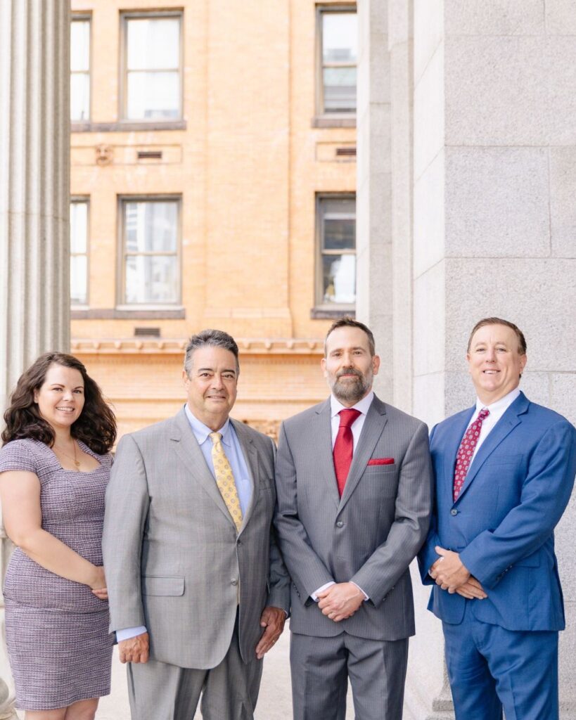 Samantha Bull, Lance Jackson, Jon Montagna and Tony Montagna of Montagna Law at the courthouse in Norfolk